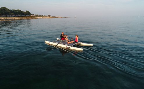Use the XCAT Katamran as a rowing platform on the water 